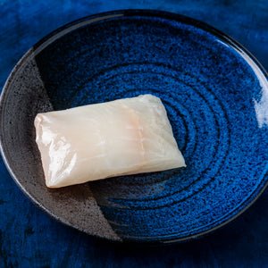 alaskan halibut fillet in a small plate