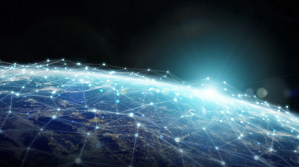 Digital network connections over Earth from space representing blockchain technology