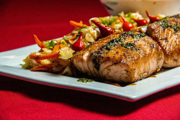 grilled salmon in white ceramic plate