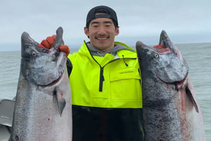 kyle holding two salmon