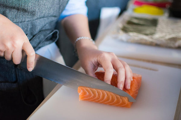 slicing a salmon fillet