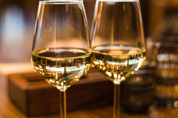 two glasses of wine for a salmon dish