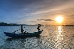 two men on a boat using a sustainable fishing technique