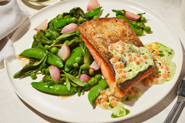 cooked wild sockeye salmon with veggies on a plate