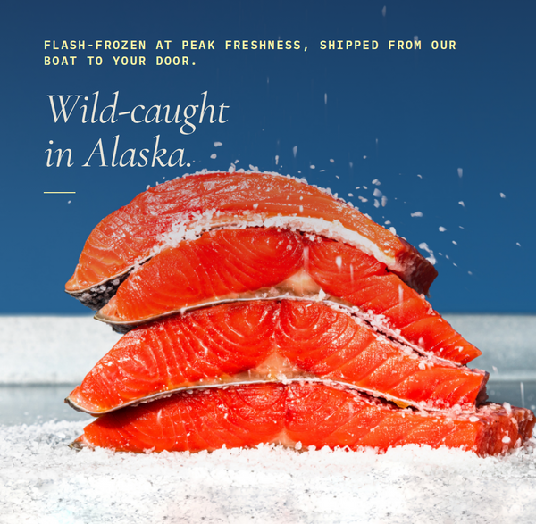 Stack of wild-caught salmon fillets with a blue background and text about freshness and origin.